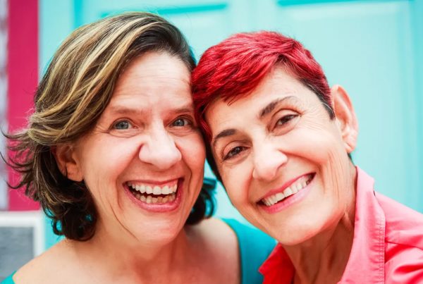 LGBTQ+ couple smiling | Pride in Senior Care | SAGE Platinum Certified Provider